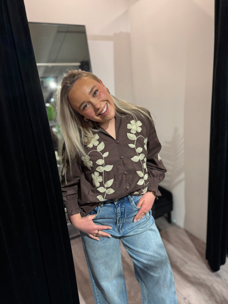 Nora’s shirt brown